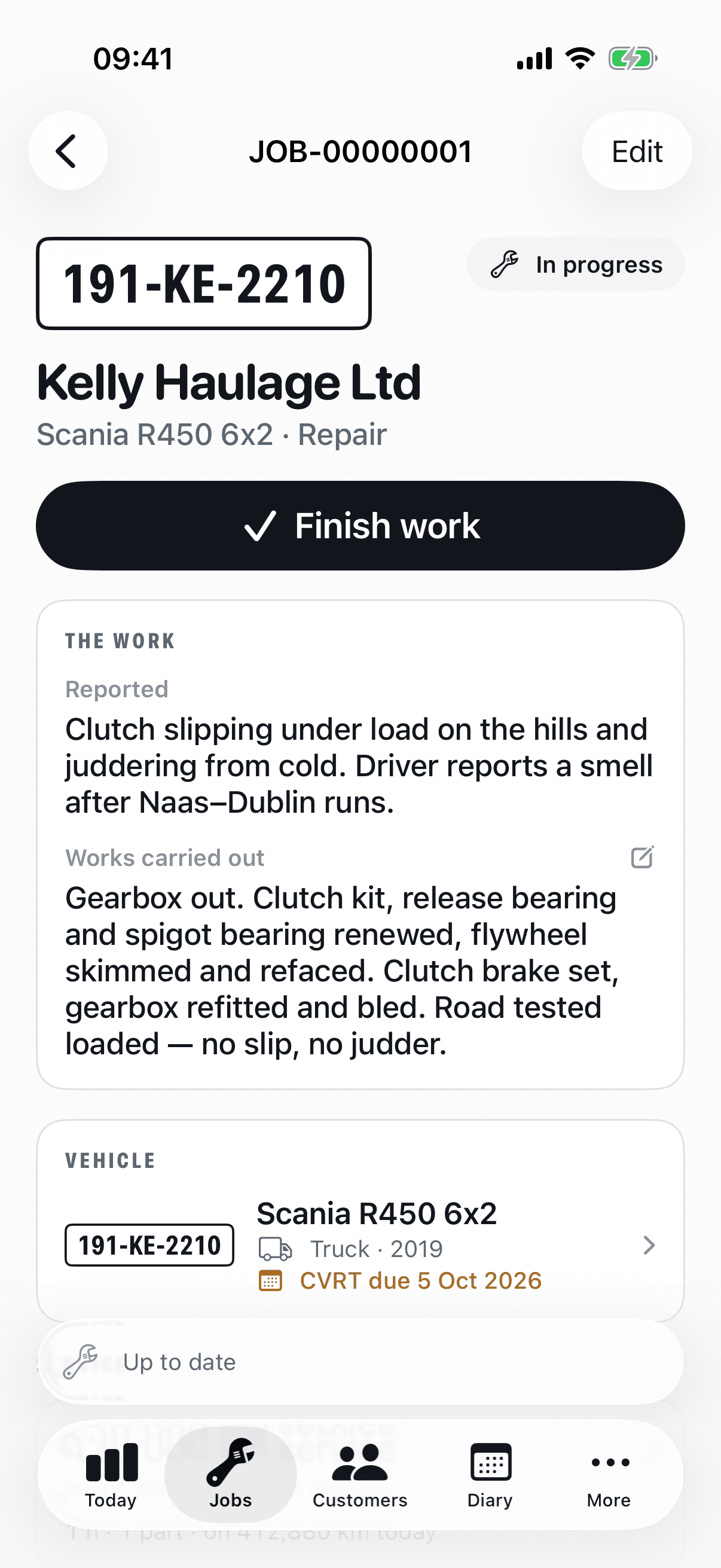 A job on iPhone: the plate, the customer, the reported fault and the works carried out, with the vehicle's CVRT date beneath